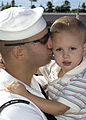 e_Controlman_1st_Class_Kris_McGuire,_stationed_aboard_guided_missile_destroyer_USS_O'Kane_(DDG_77),_kisses_his_son_goodbye_as_he_prepares_to_get_underway